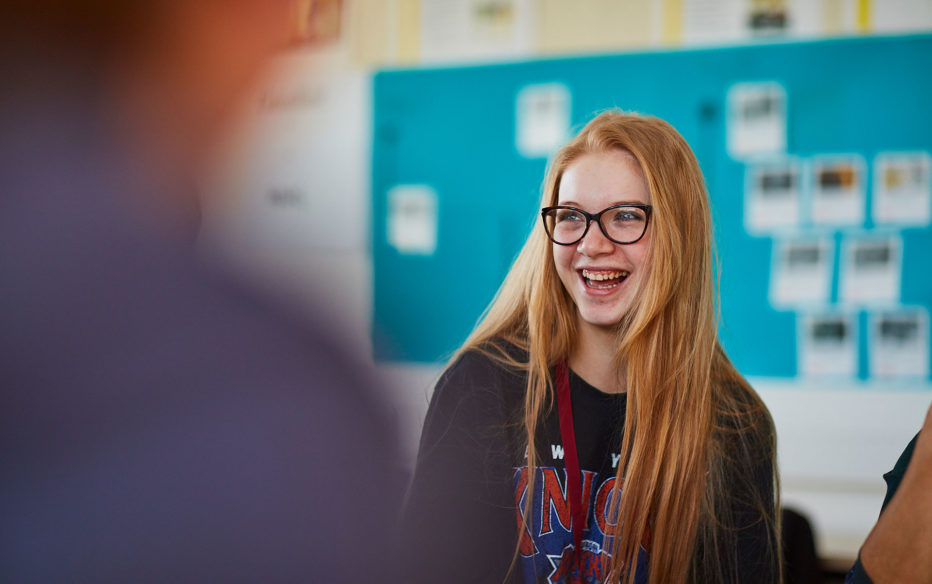 An Access to HE student smiling at the camera at Northumberland College