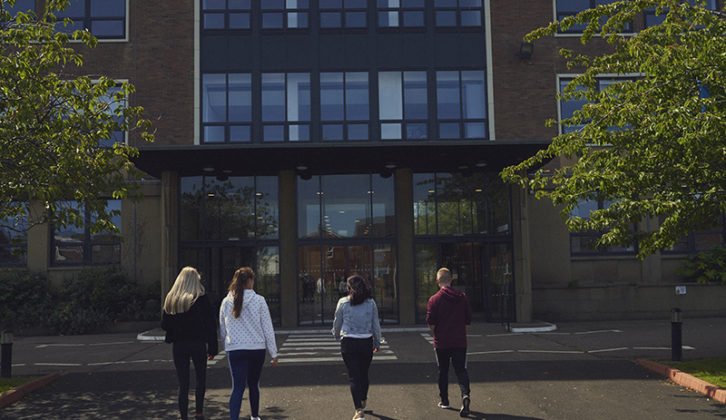 4 students walking towards Ashington Campus at Northumberland College