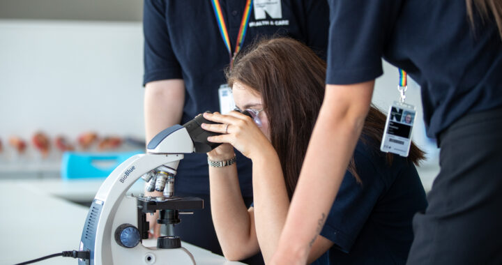A student using a microscope at Northumberland College
