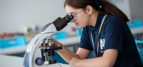 A student using a microscope at Northumberland College
